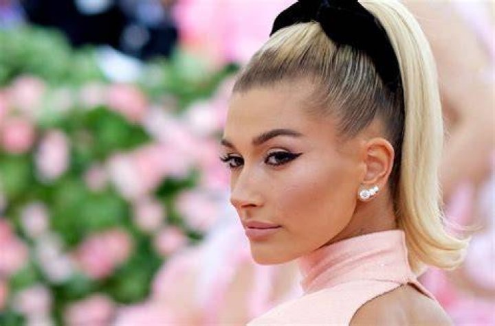 Hailey Bieber Gets Tattooed Behind Her Ear Billboard